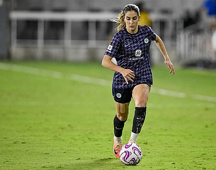 Aug 19, 2023; Louisville, Kentucky, USA; Racing Louisville FC midfielder Savannah DeMelo (7) dribbles the ball during the second half at Lynn Family Stadium. Mandatory Credit: Jamie Rhodes-USA TODAY Sports