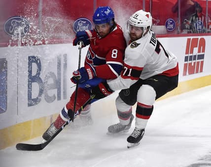 Mar 2, 2021; Montreal, Quebec, CAN; Montreal Canadiens defenseman Ben Chiarot (8) and Ottawa Senators forward Chris Tierney (71) battle for the puck during the first period at the Bell Centre. Mandatory Credit: Eric Bolte-USA TODAY Sports