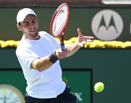 Oct 13, 2021; Indian Wells, CA, USA; Aslan Karatsev (RUS) hits a shot during his fourth round match against Hubert Hurkacz (POL) during the BNP Paribas Open at the Indian Wells Tennis Garden. Mandatory Credit: Jayne Kamin-Oncea-USA TODAY Sports