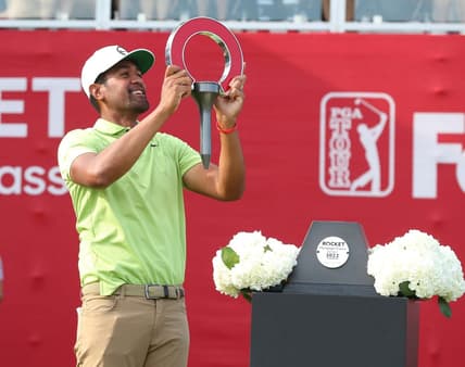Tony Finau celebrates winning the Rocket Mortgage Classic at the Detroit Golf Club, Sunday, July 31, 2022.