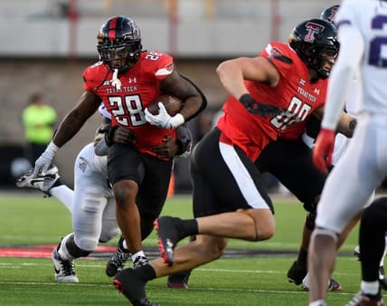 Texas Tech's running back Tahj Brooks (28) runs with the ball against TCU in a Big 12 football game, Thursday, Nov. 2, 2023, at Jones AT&T Stadium.