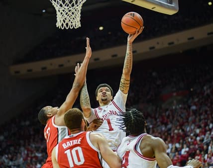 Jan 6, 2024; Bloomington, Indiana, USA; Indiana Hoosiers center Kel'el Ware (1) attempts a shot past Ohio State Buckeyes forward Zed Key (23) during the first half at Simon Skjodt Assembly Hall. Mandatory Credit: Robert Goddin-USA TODAY Sports
