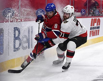 Mar 2, 2021; Montreal, Quebec, CAN; Montreal Canadiens defenseman Ben Chiarot (8) and Ottawa Senators forward Chris Tierney (71) battle for the puck during the first period at the Bell Centre. Mandatory Credit: Eric Bolte-USA TODAY Sports