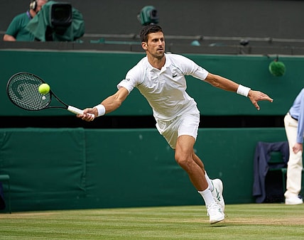 Jul 11, 2021; London, United Kingdom; Novak Djokovic (SRB) plays against Matteo Berrettini (ITA) in the men s final on Centre Court at All England Lawn Tennis and Croquet Club. Mandatory Credit: Peter van den Berg-USA TODAY Sports