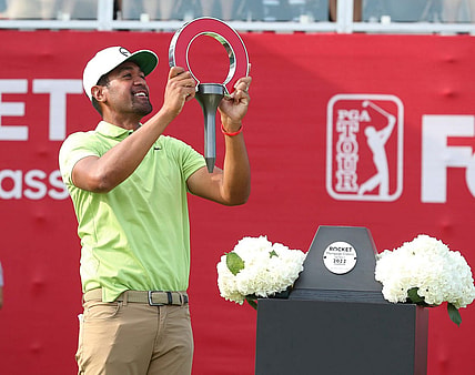 Tony Finau celebrates winning the Rocket Mortgage Classic at the Detroit Golf Club, Sunday, July 31, 2022.