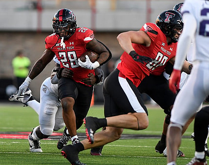 Texas Tech's running back Tahj Brooks (28) runs with the ball against TCU in a Big 12 football game, Thursday, Nov. 2, 2023, at Jones AT&T Stadium.