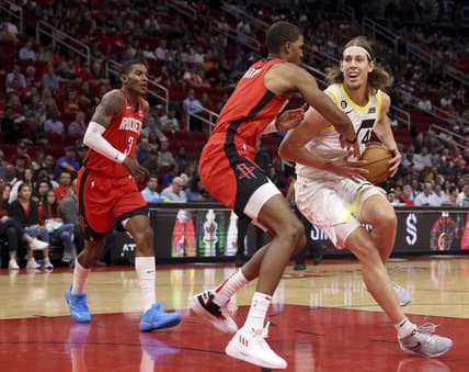 Oct 24, 2022; Houston, Texas, USA; Utah Jazz forward Kelly Olynyk (41) dribbles against Houston Rockets forward Jabari Smith Jr. (1) in the second quarter at Toyota Center. Mandatory Credit: Thomas Shea-USA TODAY Sports