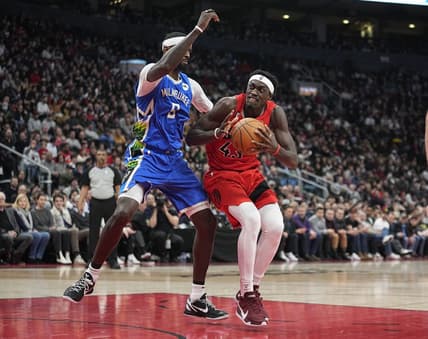 Jan 4, 2023; Toronto, Ontario, CAN; Toronto Raptors forward Pascal Siakam (43) drives to the net against Milwaukee Bucks forward Bobby Portis (9) during the first half at Scotiabank Arena. Mandatory Credit: John E. Sokolowski-USA TODAY Sports