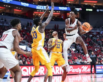 Louisville's Mike James looks to pass around the Pitt defense in the first half at the KFC Center Wednesday night. Jan. 18, 2023

Louisville Vs Pitt Jan 18 2023