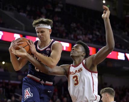 Mar 2, 2023; Los Angeles, California, USA;  Arizona Wildcats guard Kerr Kriisa (25) beats USC Trojans forward Vincent Iwuchukwu (3) to a rebound in the first half at Galen Center. Mandatory Credit: Jayne Kamin-Oncea-USA TODAY Sports