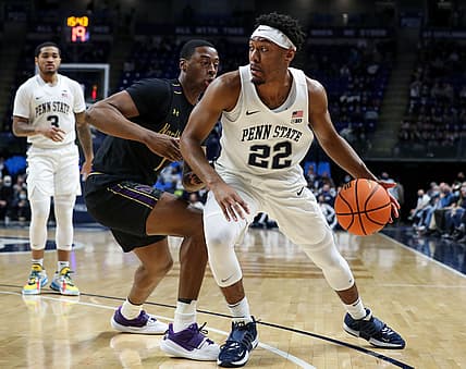 Feb 25, 2022; University Park, Pennsylvania, USA; Penn State Nittany Lions guard Jalen Pickett (22) dribbles the ball around Northwestern Wildcats guard Boo Buie (0) during the first half at Bryce Jordan Center. Mandatory Credit: Matthew OHaren-USA TODAY Sports