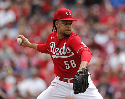 Jun 26, 2021; Cincinnati, Ohio, USA; Cincinnati Reds starting pitcher Luis Castillo (58) throws a pitch against the Atlanta Braves during the first inning at Great American Ball Park. Mandatory Credit: David Kohl-USA TODAY Sports