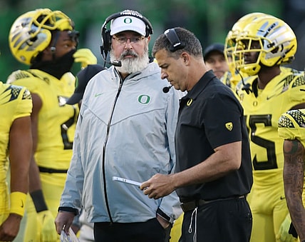 Oregon offensive coordinator Joe Moorhead, left, and head coach Mario Cristobal, on the sidelines during the game against Stony Brook.

Eug 101421 Moorhead05