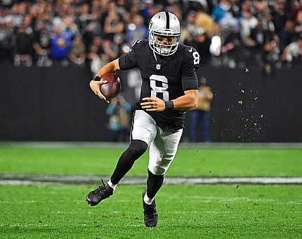 Jan 9, 2022; Paradise, Nevada, USA; Las Vegas Raiders quarterback Marcus Mariota (8) rushes with the ball during the fourth quarter against the Los Angeles Chargers at Allegiant Stadium. Mandatory Credit: Stephen R. Sylvanie-USA TODAY Sports
