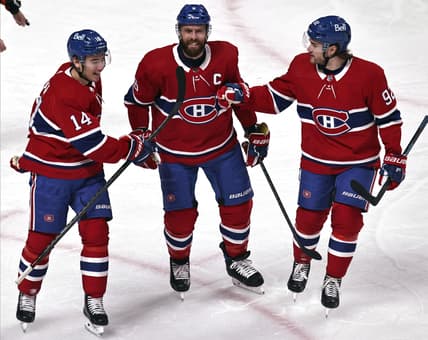 Apr 3, 2021; Montreal, Quebec, CAN; Montreal Canadiens center Nick Suzuki (14) and defenseman Shea Weber (6) and left wing Jonathan Drouin (92) celebrate after goal by right wing Tyler Toffoli (not pictured) against the Ottawa Senators during the first period at Bell Centre. Mandatory Credit: Jean-Yves Ahern-USA TODAY Sports