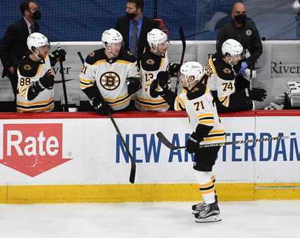 May 17, 2021; Washington, District of Columbia, USA; Boston Bruins left wing Taylor Hall (71) is congratulated by teammates after scoring a goal against the Washington Capitals during the third period in game two of the first round of the 2021 Stanley Cup Playoffs at Capital One Arena. Mandatory Credit: Brad Mills-USA TODAY Sports