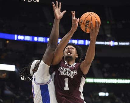 Mar 9, 2023; Nashville, TN, USA;  Mississippi State Bulldogs forward Tolu Smith (1) shoots over Florida Gators center Jason Jitoboh (33) during the first half at Bridgestone Arena. Mandatory Credit: Steve Roberts-USA TODAY Sports