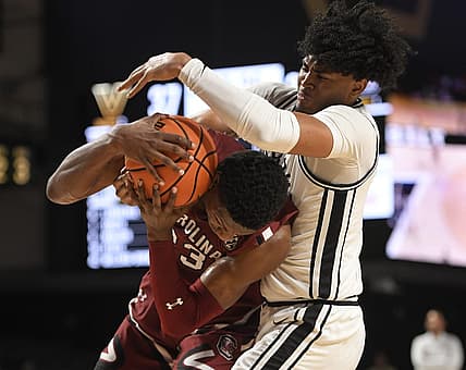 Jan 3, 2023; Nashville, Tennessee, USA; South Carolina Gamecocks forward Gregory Jackson II (23) and Vanderbilt Commodores guard Tyrin Lawrence (0) fight for the loose ball during the second half at Memorial Gymnasium. Mandatory Credit: Steve Roberts-USA TODAY Sports