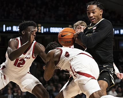 Jan 14, 2023; Nashville, Tennessee, USA;   Arkansas Razorbacks guard Davonte Davis (4) tries to take the ball from Vanderbilt Commodores guard Tyrin Lawrence (0) during the second half at Memorial Gymnasium. Mandatory Credit: George Walker IV - USA TODAY Sports
