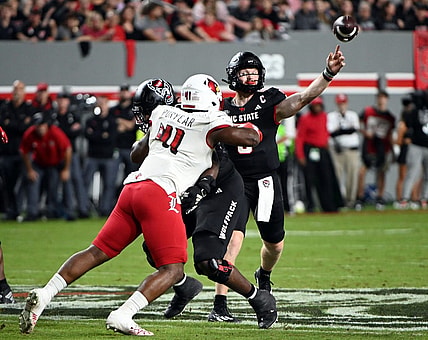 Sep 29, 2023; Raleigh, North Carolina, USA; North Carolina State Wolfpack quarterback Brennan Armstrong (5) throws a pass during the first half against the Louisville Cardinals at Carter-Finley Stadium. Mandatory Credit: Rob Kinnan-USA TODAY Sports