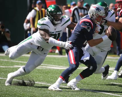 John Franklin-Myers of the Jets strips Patriots quarterback Mac Jones of the ball as the New England Patriots played the New York Jets at MetLife Stadium in East Rutherford, New Jersey, on Sept. 19, 2021.
The New England Patriots Came To Play The Ny Jets At Metlife Stadium In East Rutherford Nj On September 19 2021