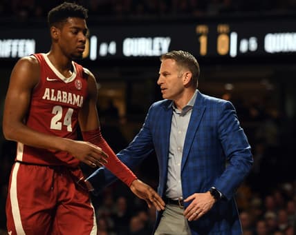 Jan 17, 2023; Nashville, Tennessee, USA; Alabama Crimson Tide head coach Nate Oats slaps hands with forward Brandon Miller (24) as he leaves the game during the first half against the Vanderbilt Commodores at Memorial Gymnasium. Mandatory Credit: Christopher Hanewinckel-USA TODAY Sports
