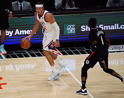 Apr 1, 2021; Los Angeles, California, USA; Denver Nuggets forward Aaron Gordon (50) controls the ball against Los Angeles Clippers guard Reggie Jackson (1) during the first half at Staples Center. Mandatory Credit: Gary A. Vasquez-USA TODAY Sports