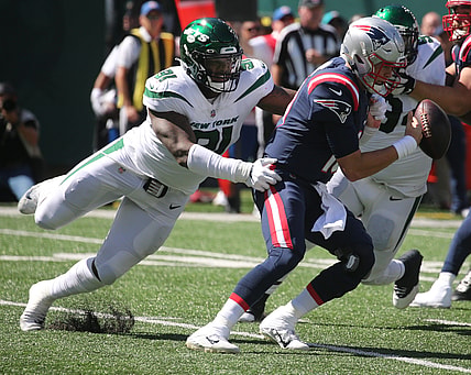 John Franklin-Myers of the Jets strips Patriots quarterback Mac Jones of the ball as the New England Patriots played the New York Jets at MetLife Stadium in East Rutherford, New Jersey, on Sept. 19, 2021.

The New England Patriots Came To Play The Ny Jets At Metlife Stadium In East Rutherford Nj On September 19 2021