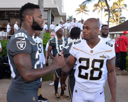 Caption: Jan 29, 2016; Kahuku, HI, USA; Oakland Raiders running back Latavius Murray (left) and Minnesota Vikings running back Adrian Peterson (28) during 2016 Pro Bowl photo day at Turtle Bay Resort. Mandatory Credit: Kirby Lee-USA TODAY Sports