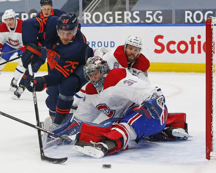 Apr 19, 2021; Edmonton, Alberta, CAN; Montreal Canadiens goaltender Carey Price (31) makes a save on Edmonton Oilers forward Leon Draisaitl (29) during the first period at Rogers Place. Mandatory Credit: Perry Nelson-USA TODAY Sports