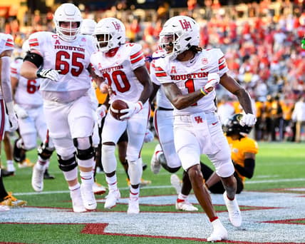 Sep 18, 2021; Houston, Texas, USA;  Houston Cougars wide receiver Nathaniel Dell (1) celebrates his touchdown during the first half against the Grambling State Tigers at TDECU Stadium. Mandatory Credit: Maria Lysaker-USA TODAY Sports
