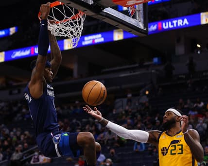 Jan 30, 2022; Minneapolis, Minnesota, USA; Utah Jazz forward Royce O'Neale (23) catches the ball after Minnesota Timberwolves forward Jarred Vanderbilt (8) dunked it during the first quarter at Target Center. Mandatory Credit: Harrison Barden-USA TODAY Sports