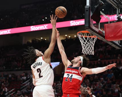 Mar 12, 2022; Portland, Oregon, USA; Portland Trail Blazers forward Trendon Watford (2) shoots against Washington Wizards guard Corey Kispert (24) during the second half at Moda Center. Mandatory Credit: Al Sermeno-USA TODAY Sports
