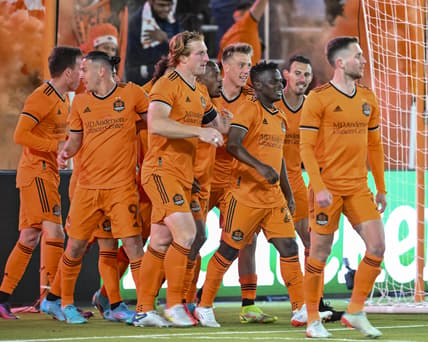 Mar 12, 2022; Houston, Texas, USA;  Houston Dynamo FC forward Darwin Quintero (23) celebrates with teammates after his second goal of the match against the Vancouver Whitecaps at PNC Stadium. Mandatory Credit: Maria Lysaker-USA TODAY Sports