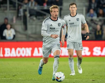 Mar 19, 2022; Saint Paul, Minnesota, USA; San Jose Earthquakes midfielder Jackson Yueill (14) moves the ball upfield against Minnesota United in the second half at Allianz Field. Mandatory Credit: Matt Blewett-USA TODAY Sports