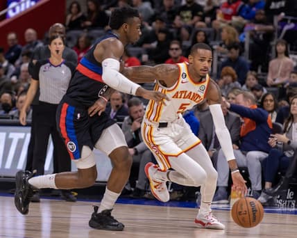 Oct 26, 2022; Detroit, Michigan, USA; Detroit Pistons guard Hamidou Diallo (6) defends against Atlanta Hawks guard Dejounte Murray (5) during the first half at Little Caesars Arena. Mandatory Credit: David Reginek-USA TODAY Sports