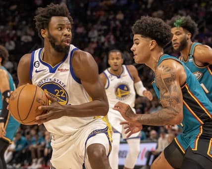 Oct 30, 2022; Detroit, Michigan, USA; Detroit Pistons guard Killian Hayes (7) defends against Golden State Warriors forward Andrew Wiggins (22) during the in the first half at Little Caesars Arena. Mandatory Credit: David Reginek-USA TODAY Sports