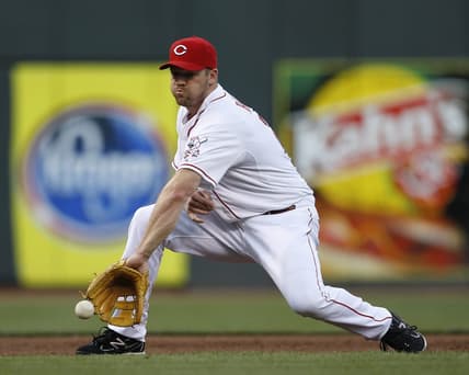 AUGUST 17, 2012: Cincinnati Reds third baseman Scott Rolen (27) makes the grab and the throw to first for the out in the third inning against the Chicago Cubs.

Reds