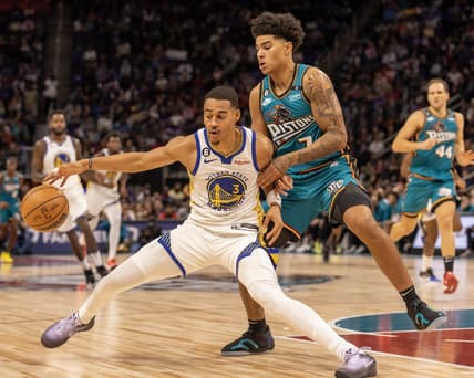 Oct 30, 2022; Detroit, Michigan, USA; Detroit Pistons guard Killian Hayes (7) defends against Golden State Warriors guard Jordan Poole (3) during the in the first half at Little Caesars Arena. Mandatory Credit: David Reginek-USA TODAY Sports