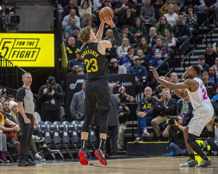 Dec 31, 2022; Salt Lake City, Utah, USA; Utah Jazz forward-center Lauri Markkanen (23) shoots the ball against Miami Heat forward Haywood Highsmith (24) during the first quarter at Vivint Arena. Mandatory Credit: Christopher Creveling-USA TODAY Sports