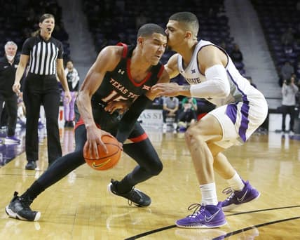 Jan 15, 2022; Manhattan, Kansas, USA;  Texas Tech Red Raiders guard Kevin McCullar (15) is guarded by Kansas State Wildcats guard Mike McGuirl (00) during the second half at Bramlage Coliseum. Mandatory Credit: Scott Sewell-USA TODAY Sports
