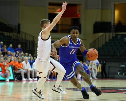 Nov 23, 2023; Kissimmee, FL, USA;  Boise State Broncos guard Chibuzo Agbo (11) drives past Virginia Tech Hokies guard Sean Pedulla (3) in the first half during the ESPN Events Invitational at State Farm Field House. Mandatory Credit: Nathan Ray Seebeck-USA TODAY Sports