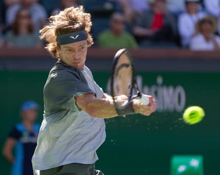 Andrey Rublev returns against Andy Murray during a BNP Paribas Open match at Indian Wells Tennis Garden in Indian Wells, California, on March 8, 2024.
