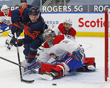 Apr 19, 2021; Edmonton, Alberta, CAN; Montreal Canadiens goaltender Carey Price (31) makes a save on Edmonton Oilers forward Leon Draisaitl (29) during the first period at Rogers Place. Mandatory Credit: Perry Nelson-USA TODAY Sports