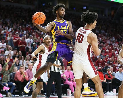 Mar 2, 2022; Fayetteville, Arkansas, USA; Arkansas Razorbacks guard JD Notae (1) and forward Jaylin Williams (10) defend as LSU Tigers forward Tari Eason (13) passes in the first half at Bud Walton Arena. Mandatory Credit: Nelson Chenault-USA TODAY Sports