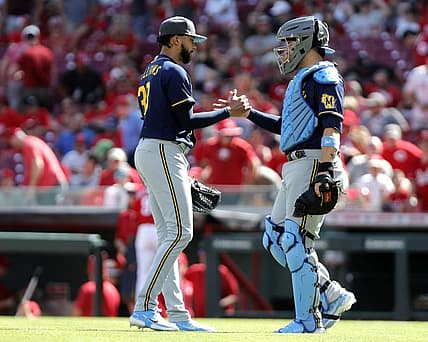 Jun 19, 2022; Cincinnati, Ohio, USA; Milwaukee Brewers closing pitcher Devin Williams (38) reacts with catcher Victor Caratini (7) after the Brewers defeated the Cincinnati Reds at Great American Ball Park. Mandatory Credit: David Kohl-USA TODAY Sports