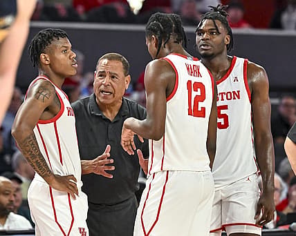 Nov 7, 2022; Houston, Texas, USA; Houston Cougars head coach Kelvin Sampson speaks with guard Tramon Mark (12) and guard Marcus Sasser (0) and forward Jarace Walker (25) during the second half against the Northern Colorado Bears at Fertitta Center. Mandatory Credit: Maria Lysaker-USA TODAY Sports