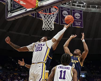 Nov 9, 2022; Baton Rouge, Louisiana, USA; LSU Tigers forward Derek Fountain (20) grabs a rebound against UMKC Kangaroos guard Shemarri Allen (5) during the second half at Pete Maravich Assembly Center. Mandatory Credit: Stephen Lew-USA TODAY Sports