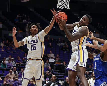 Nov 17, 2022; Baton Rouge, Louisiana, USA; LSU Tigers forward Tyrell Ward (15) goes for rebound against New Orleans Privateers forward D'Ante Bell (3) during the second half at Pete Maravich Assembly Center. Mandatory Credit: Stephen Lew-USA TODAY Sports