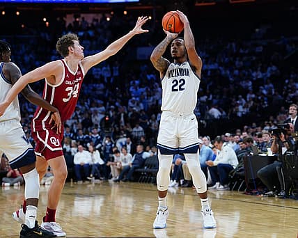 Dec 3, 2022; Philadelphia, Pennsylvania, USA; Villanova Wildcats forward Cam Whitmore (22) shoots a three point jump shot against Oklahoma Sooners forward Jacob Groves (34)during the second half at Wells Fargo Center. Mandatory Credit: Gregory Fisher-USA TODAY Sports